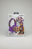 A hand holding a white retail box for a purple cartoon-style wireless headphones headset. The box features the text 'AH-706V1' and 'Wireless Headphones' with illustrations of the product and the character Emily from The Dream Team.