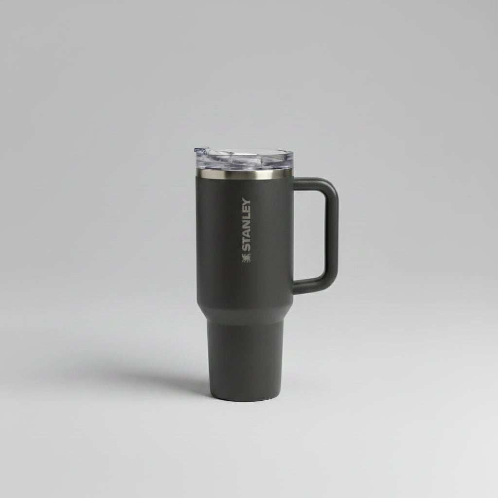 dark graycolored travel mug with handle on a gray background
