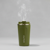 grey coffee tumblers with steam rising from the black one on a wooden surface.